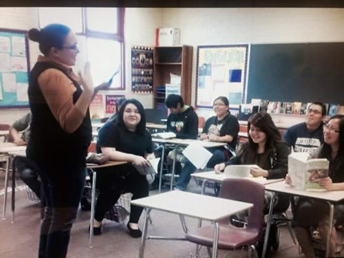 An older photo provided by teacher Sarah Garcia shows her teaching an English class to smiling students at Ganado High School.