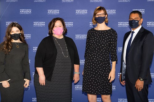 Four people involved in the creation of the Arizona Teacher Residency stand in front of a Northern Arizona University banner: Director Dr. Victoria Theisen-Homer, Arizona K12 Center Executive Director Dr. Kathy Wiebke, NBCT, Arizona State Superintendent of Public Instruction Kathy Hoffman, and Northern Arizona University President Jose Luis Cruz Rivera.